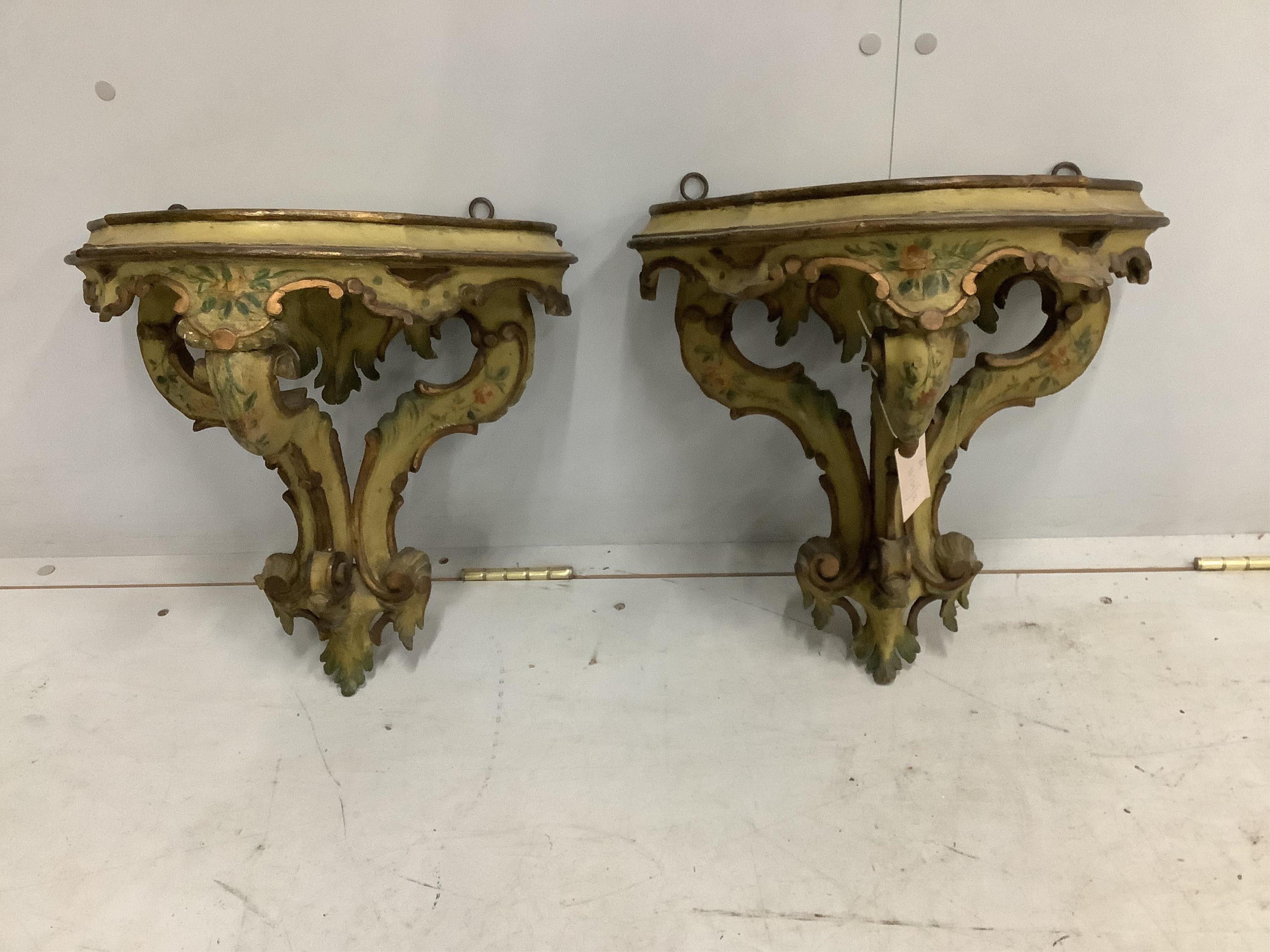 A pair of 18th century style Italian carved and painted pine wall brackets, width 38cm, depth 26cm, height 38cm. Condition - fair